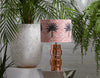 Colourful terracotta pink African batik print lampshade with large brown and black palm tree  