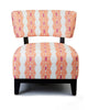 Accent Chair with a bold patterned fabric cover on a white background