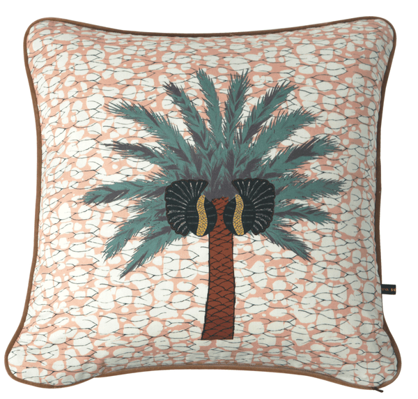 Colourful bright pink African batik print cushion with large tropical palm tree  