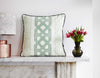 Elegant African batik print cushion with graphic green  pattern on light green batik base