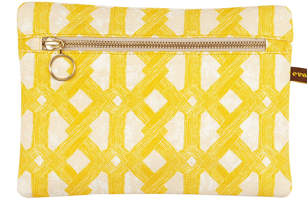 African batik print envelope bag with bright yellow geometric pattern and gold zip