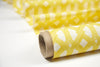 Elegant African batik interior fabric with bright yellow geometric pattern on batik base