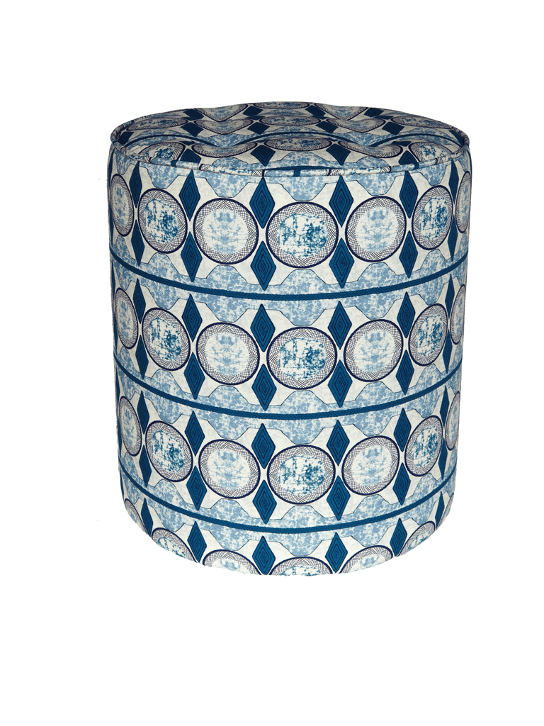 Vibrant blue and white pouffie with bold African print design