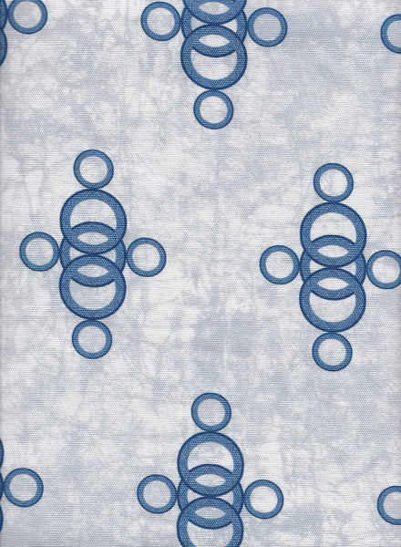Ara Blue a light blue luxury African interior fabric with circular pattern on blue batik base. Interior textile.