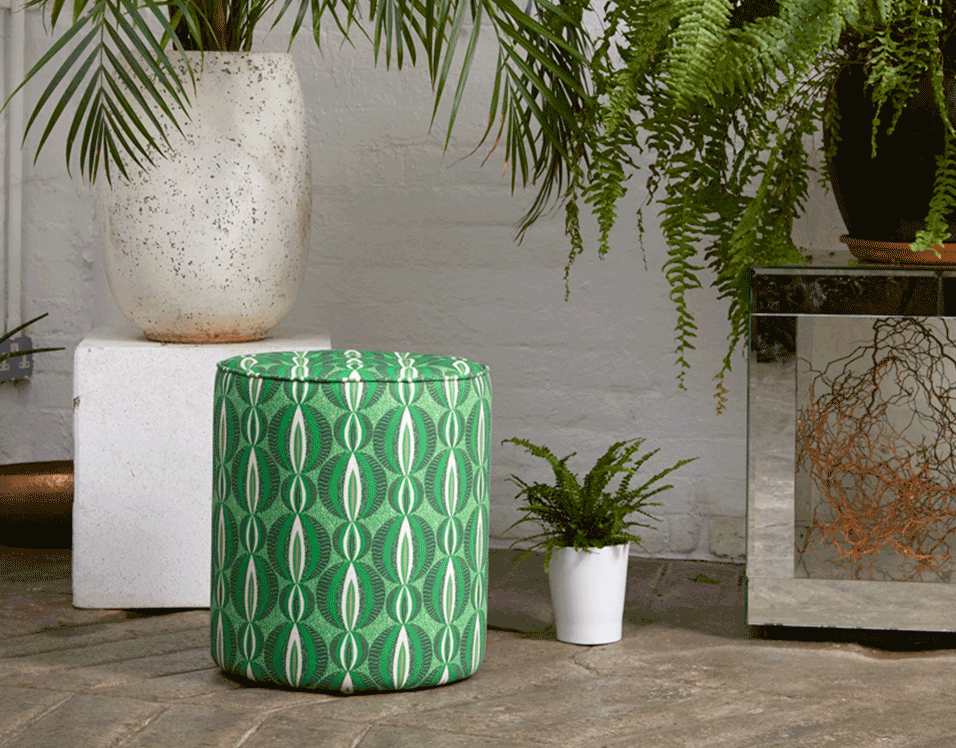 Vibrant green pouffie with circular African print design