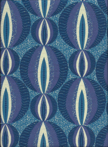 Vibrant blue modern African upholstery fabric with ethnic circular pattern and blue batik backing. Interior textile.