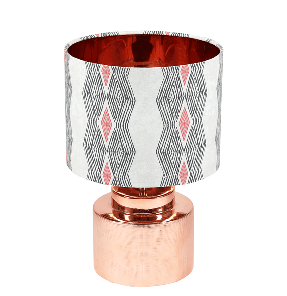 Modern geometric African table lamp with bold grey and pink pattern