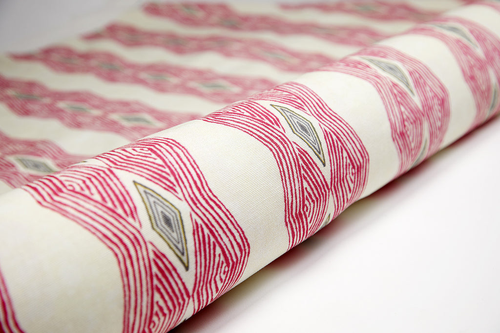 Colourful geometric African interior fabric with bold vibrant pink pattern