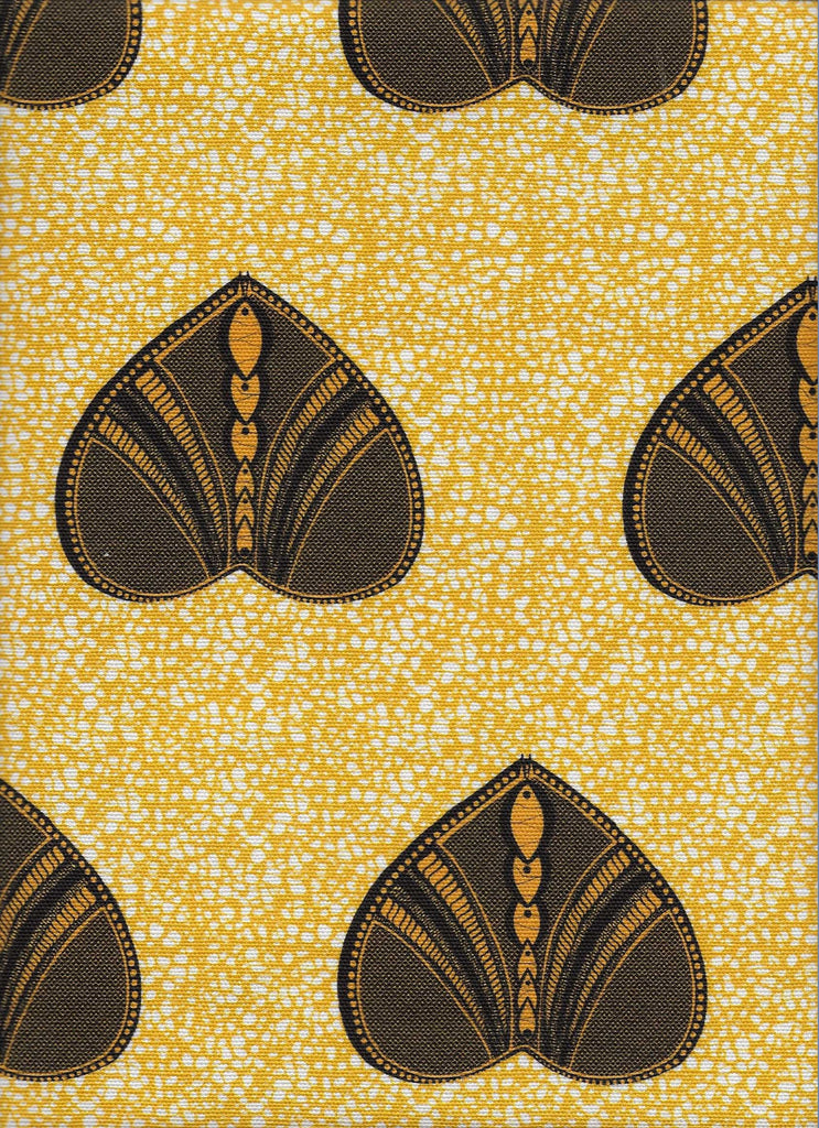 Vibrant yellow African interior fabric with heart shaped pattern on polka dot background. Interior textile.