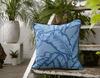 Vibrant African cushion with bold blue palm leaf design