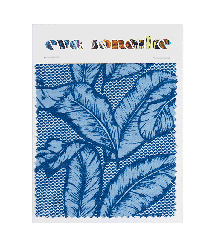 Vibrant African inspired upholstery fabric with tropical blue palm leaf design