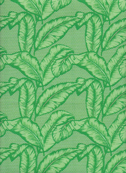 Vibrant African upholstery fabric with vibrant green palm leaf design. Interior textile.