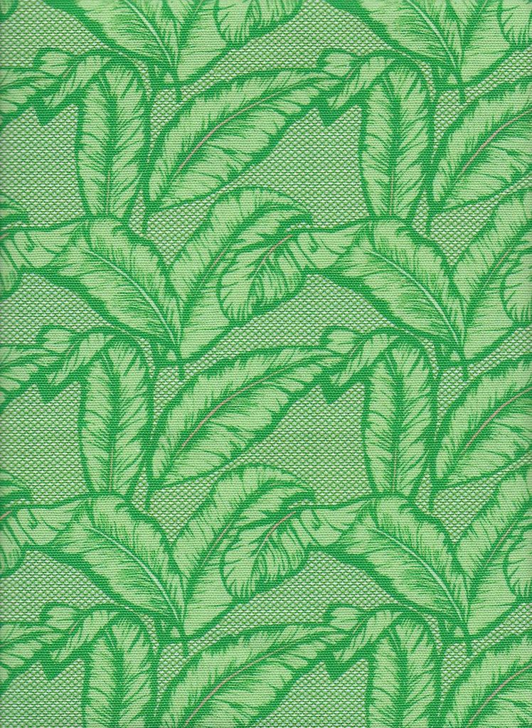 Vibrant African upholstery fabric with vibrant green palm leaf design. Interior textile.