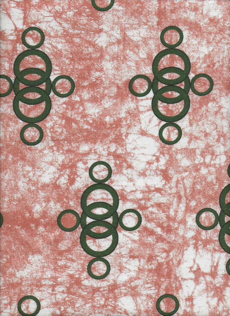 Ara Blue a terracotta pink luxury African upholstery fabric with green circular pattern on blue batik base. Interior textile.